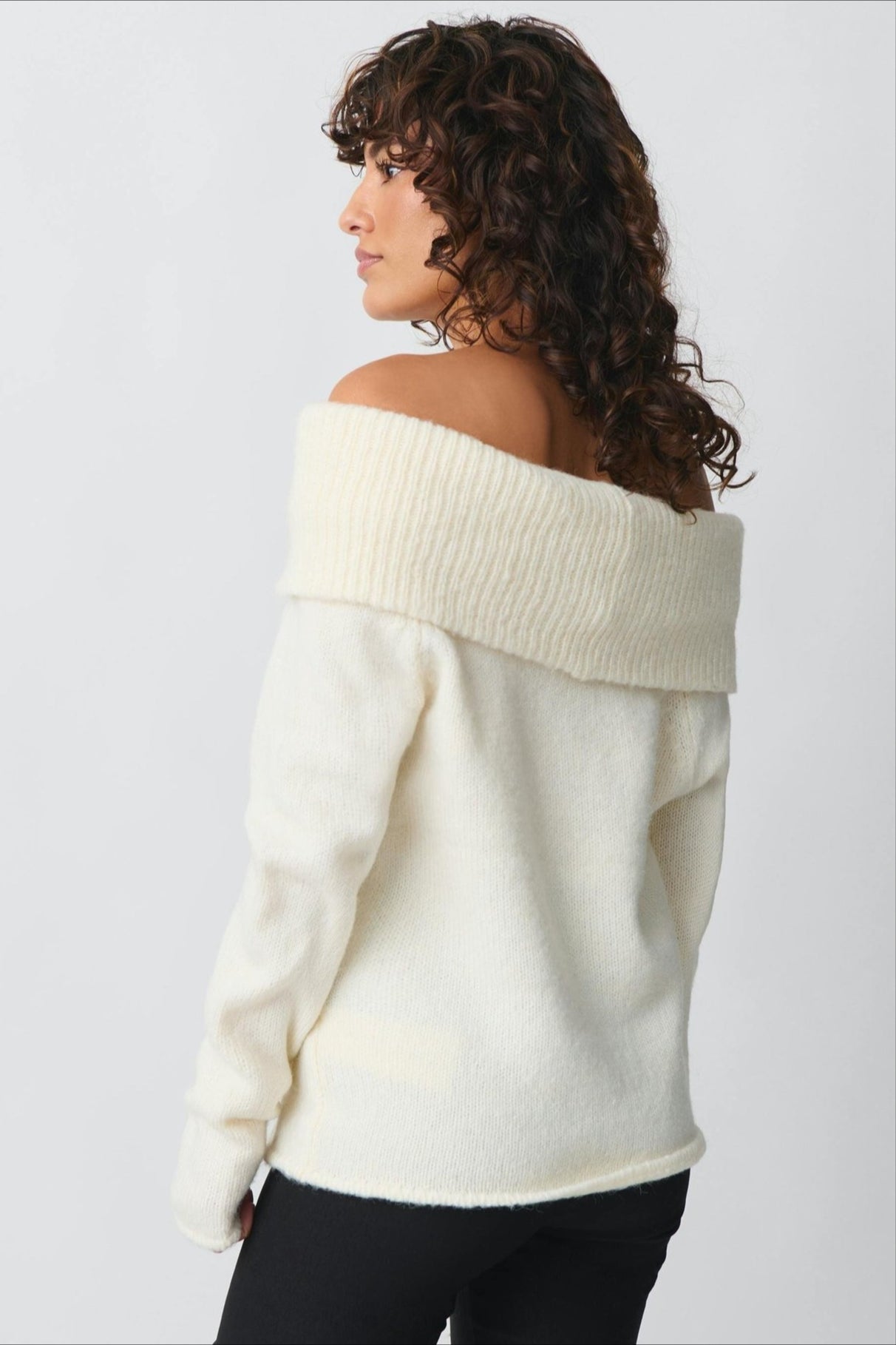 Close-up view of the sweater's foldover collar and off-shoulder neckline