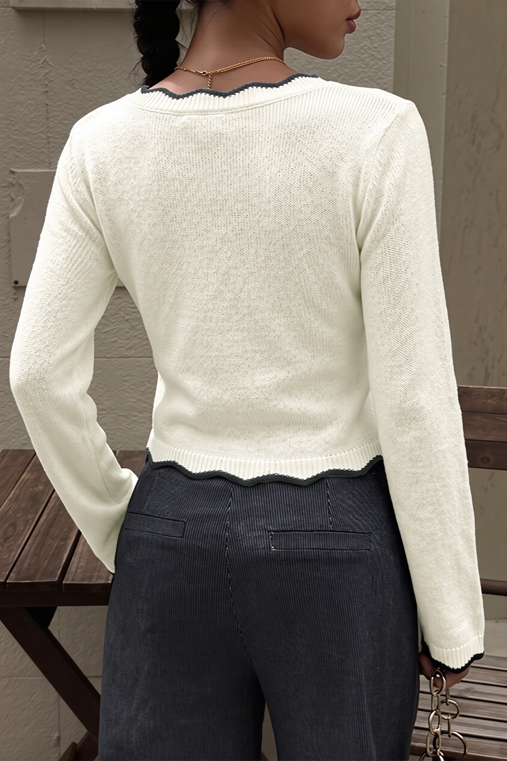 Side view of a cropped sweater showing its relaxed silhouette