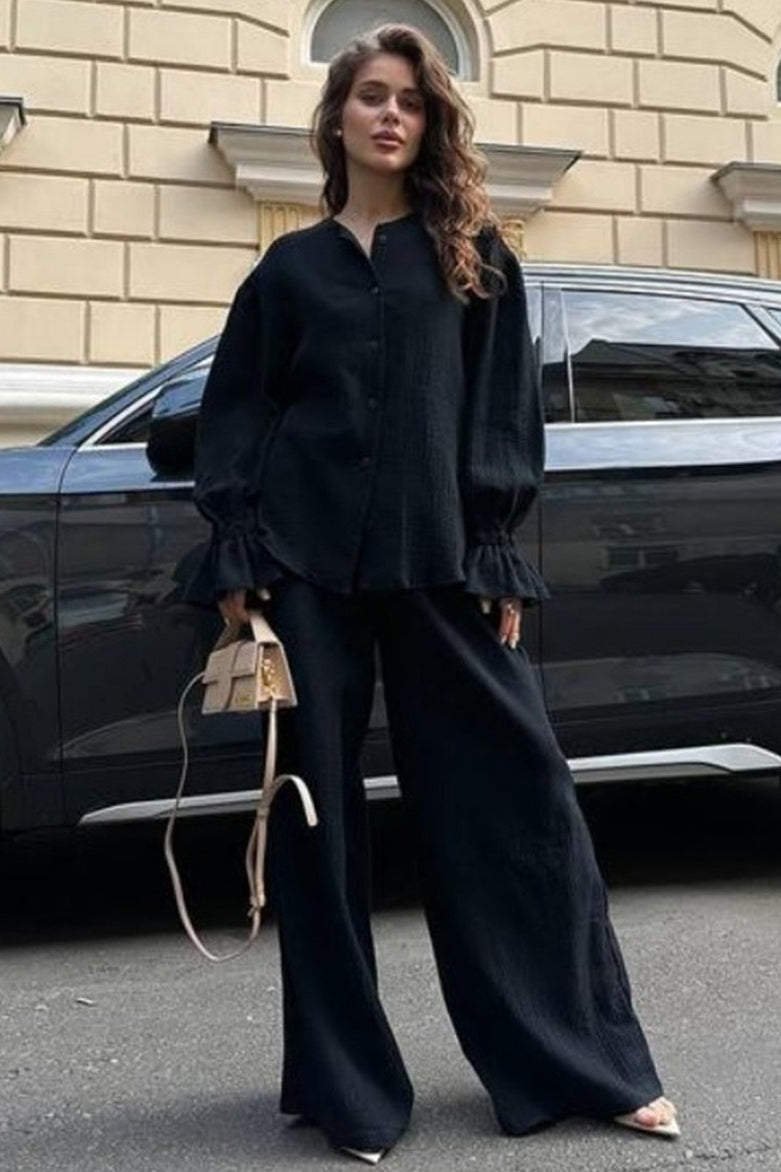 Full-length view of the women's cardigan and pants outfit