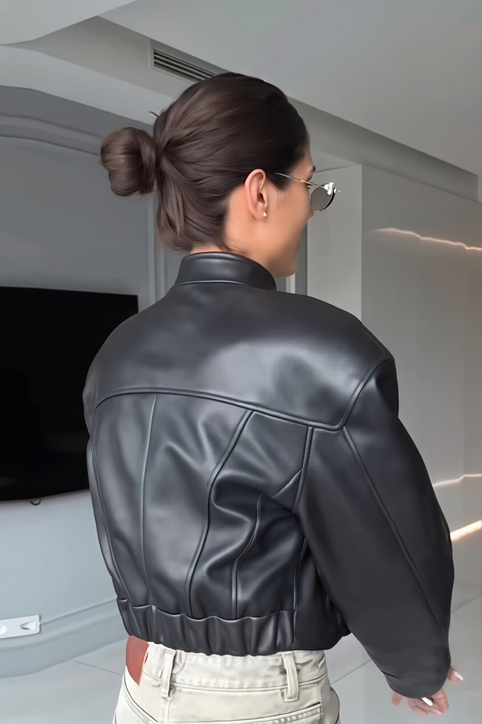 Faux leather bomber jacket styled as versatile everyday outerwear