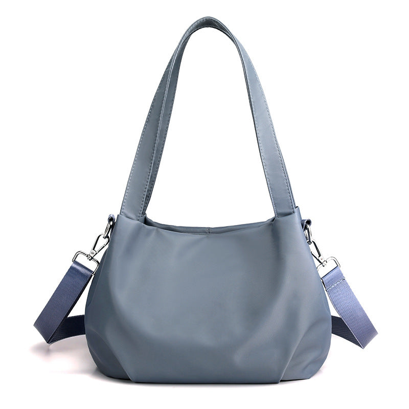 Women's lightweight nylon crossbody bag with adjustable strap, side profile