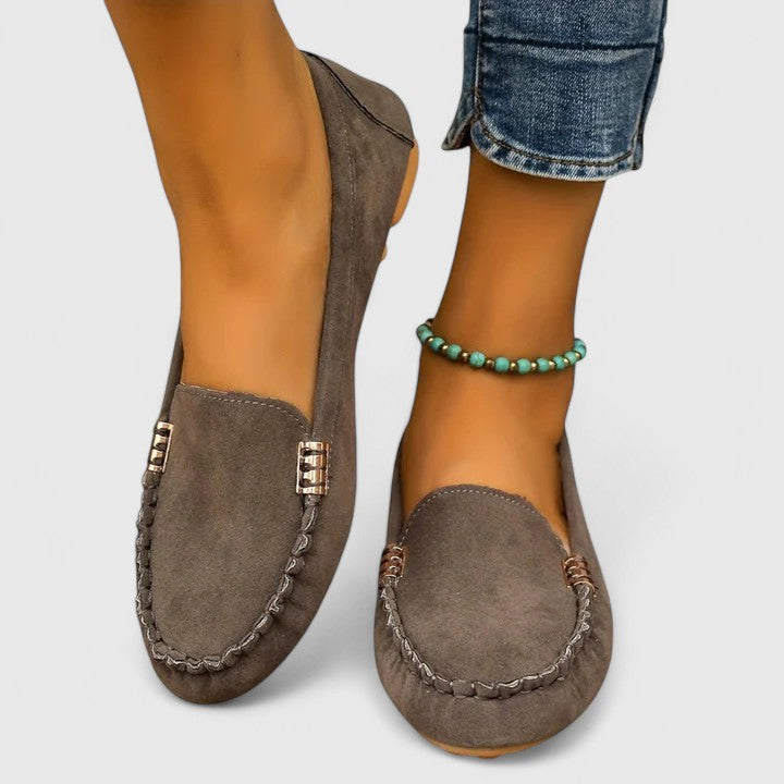 Pair of women's slip-on loafers designed for supportive comfort