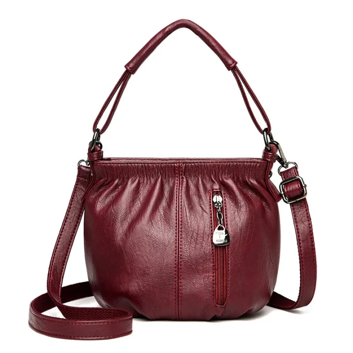 Women's crossbody shoulder bag displayed to highlight shape and storage
