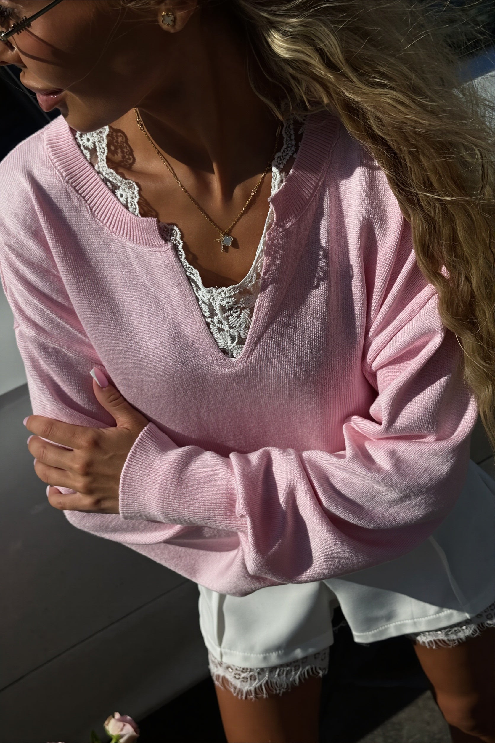 Side view of the relaxed sweater highlighting its loose, comfortable fit
