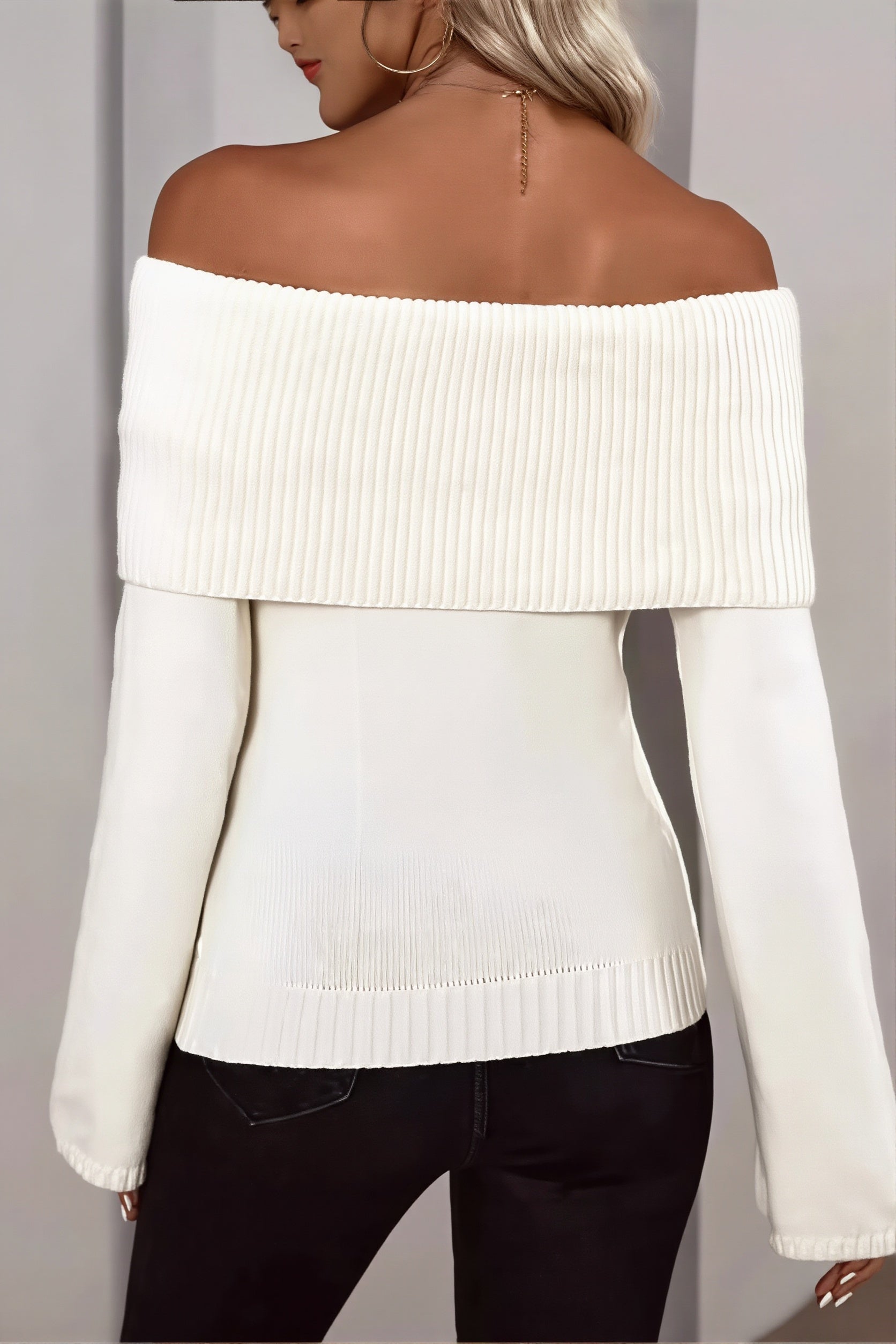 Side view of the fitted women's sweater with an off-shoulder design