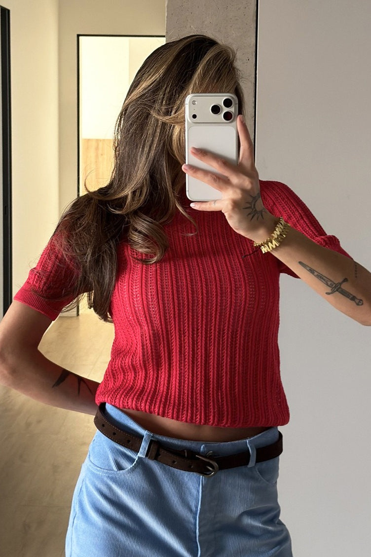 Full view of an openwork crewneck sweater