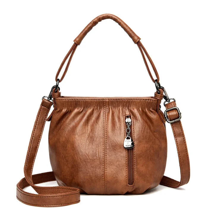 Women's PU shoulder bag shown at an angle with multiple zip compartments