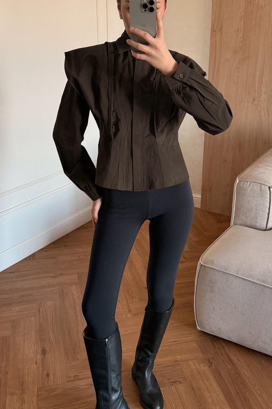 Front view of a women's shirt with a ruched waist