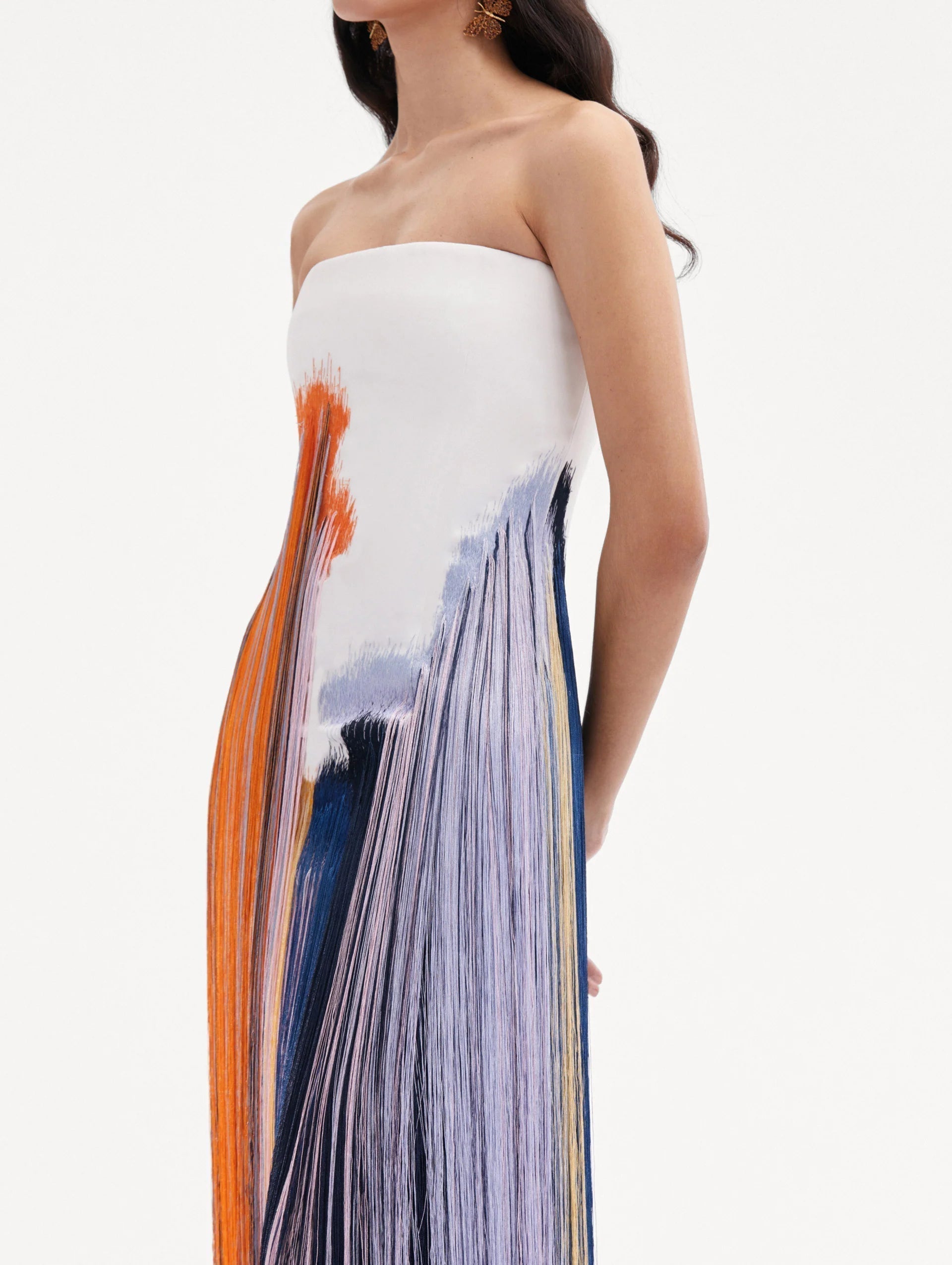 Close-up view of the brushstroke detail on a fringe midi dress