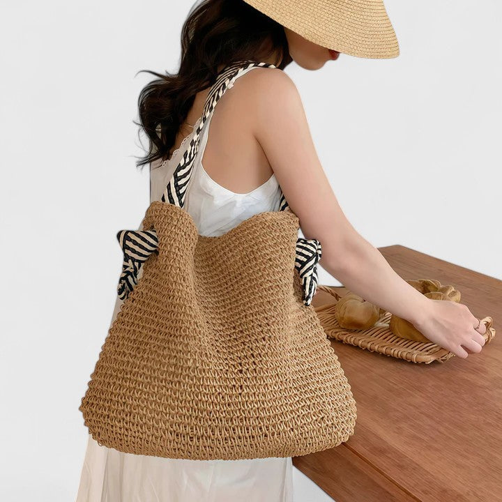 Braided shoulder tote bag angled to show woven texture