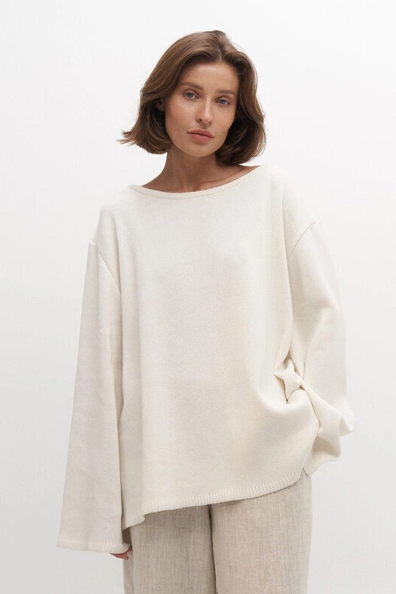 Detail view of the boat neck and soft knit construction