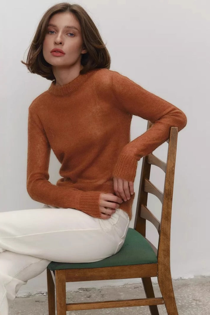 Side view of a lightweight semi-sheer crewneck sweater