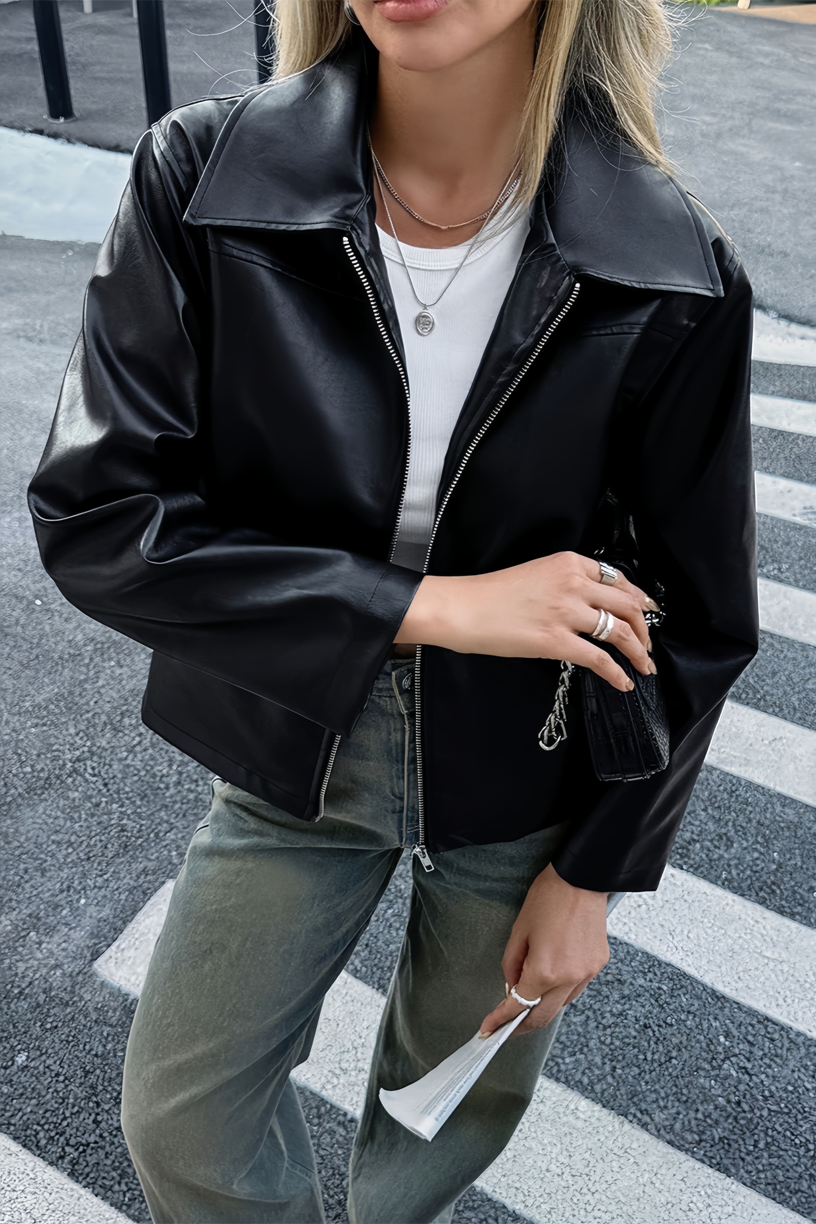 Faux leather jacket showing its tailored front silhouette