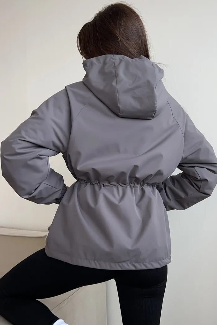 Back view of the hooded utility jacket and adjustable waist