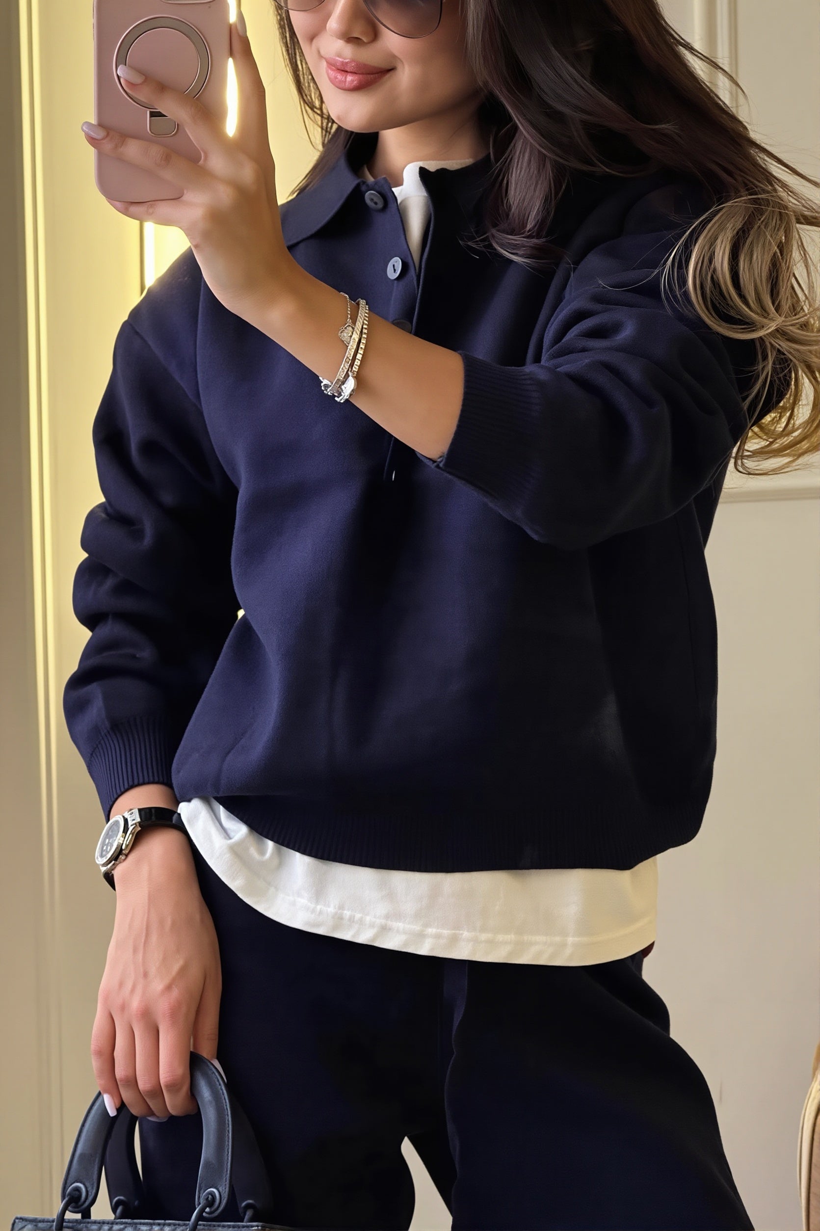 Two-piece knit outfit featuring a polo sweater and wide-leg trousers