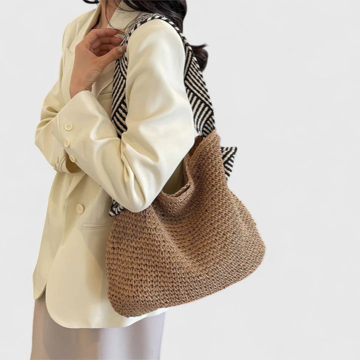 Side view of braided shoulder tote bag with shoulder straps