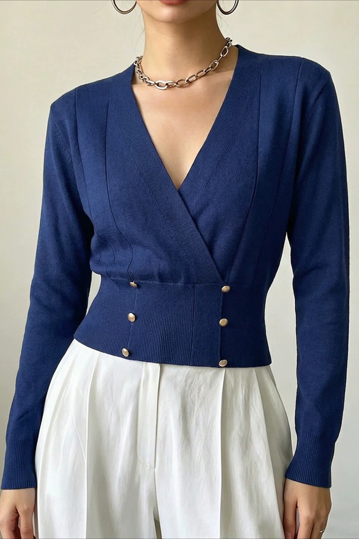 Front view of a wrap cardigan with a clean, polished silhouette