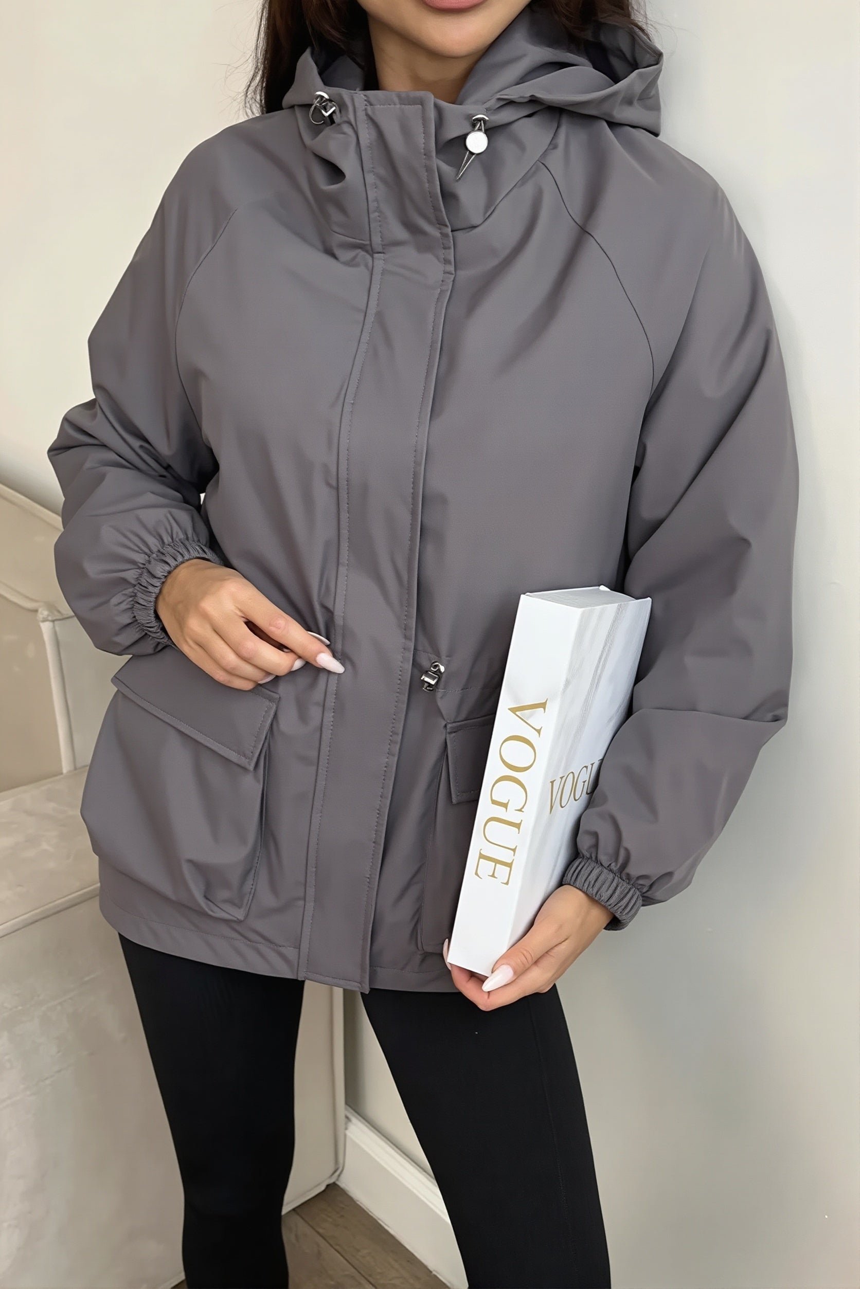 Side view of the hooded utility jacket with practical pockets