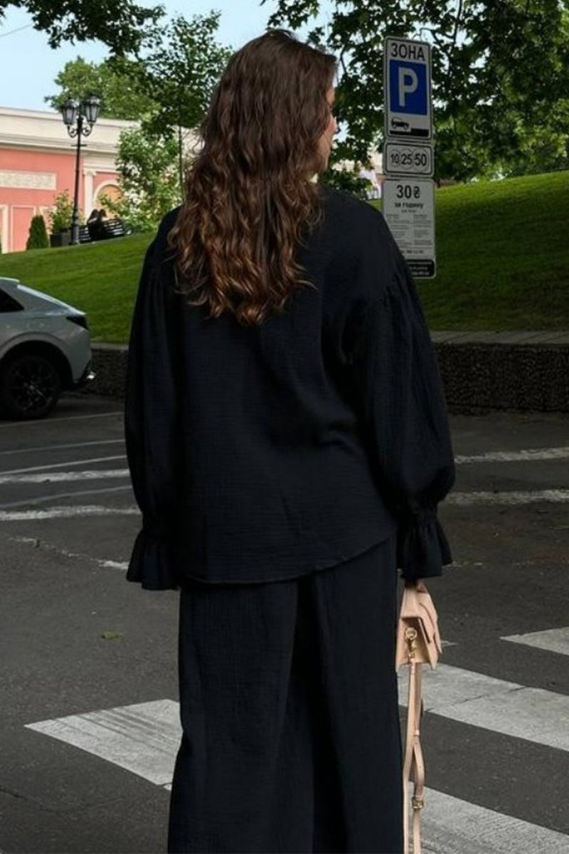 Coordinated cotton cardigan and wide-leg pants outfit from the back