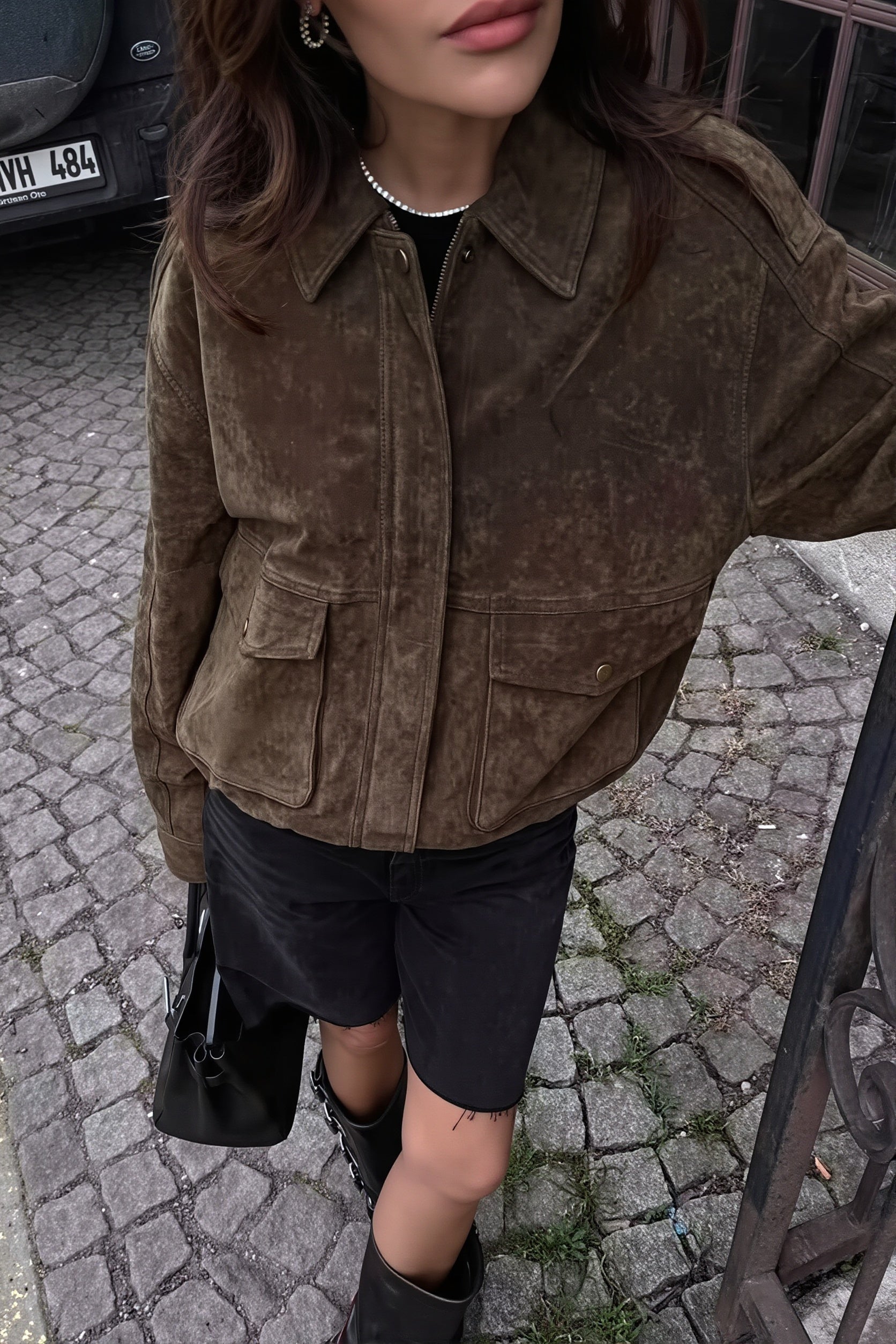 Close-up of the suede-look texture and zip front