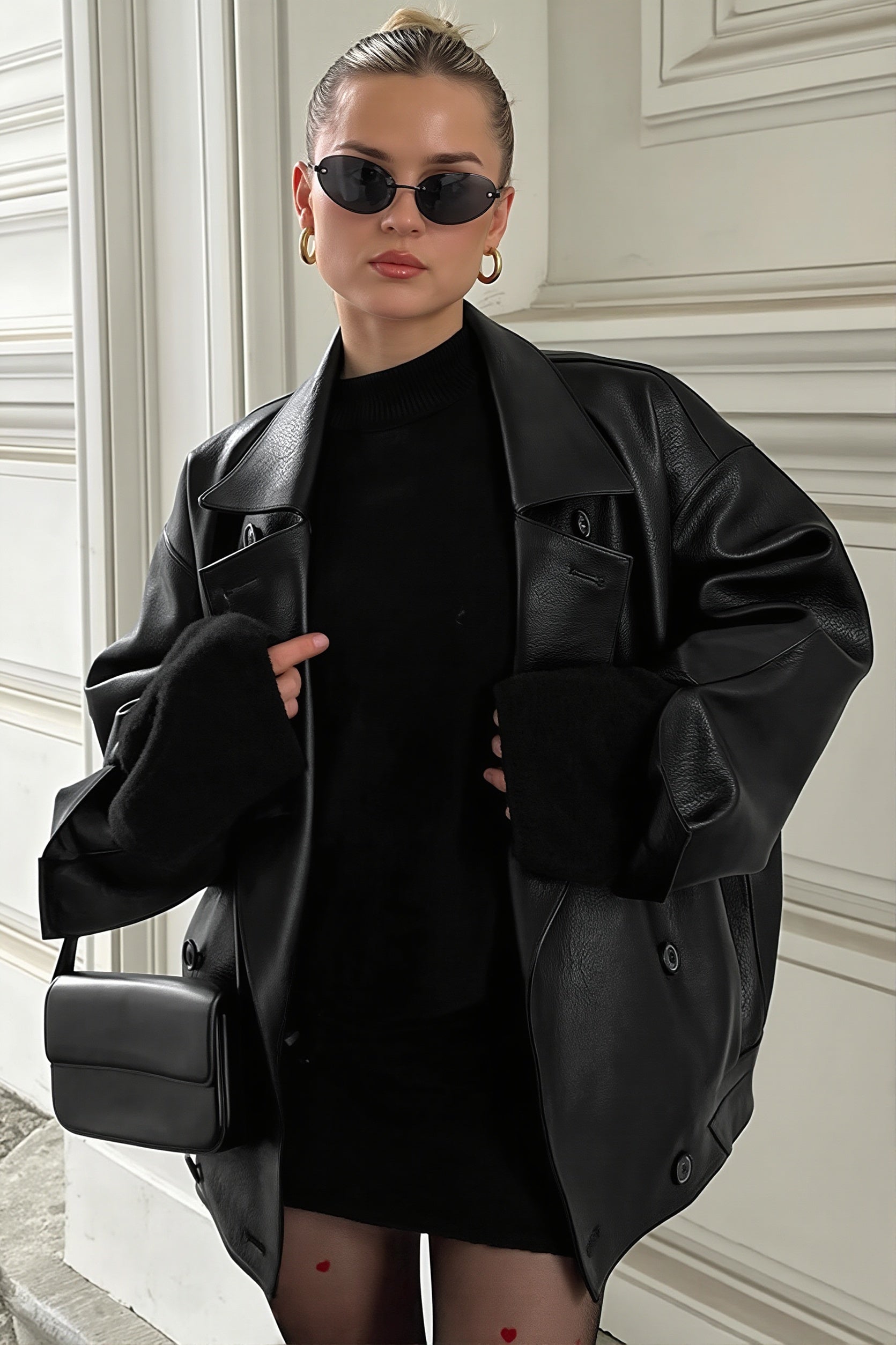 Close-up of the faux leather blazer's double-breasted front and notched lapels