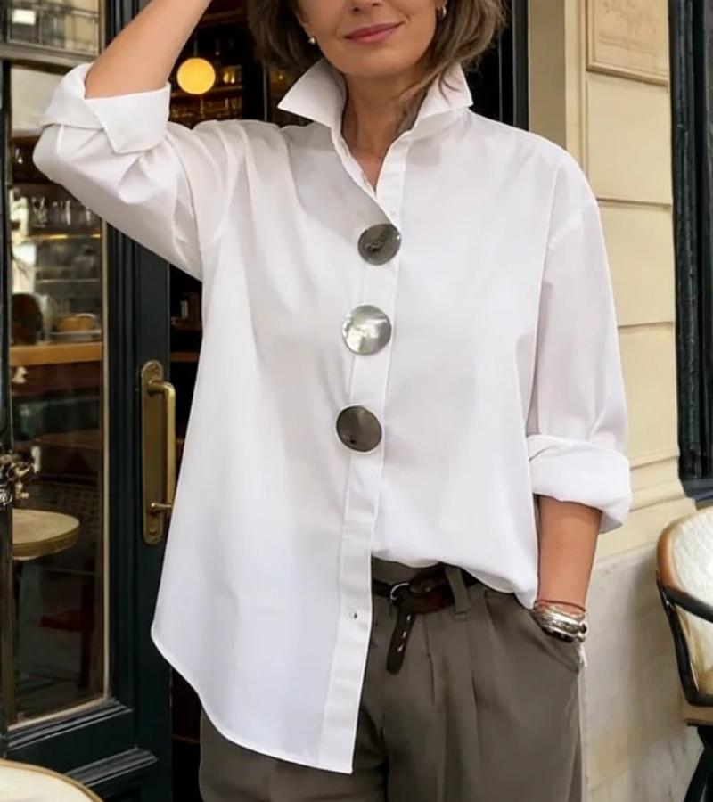 Women's structured blouse displaying its stand collar and tailored shape