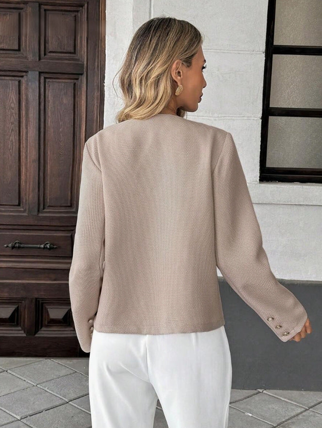 Women's short tweed jacket styled as an elegant layering piece