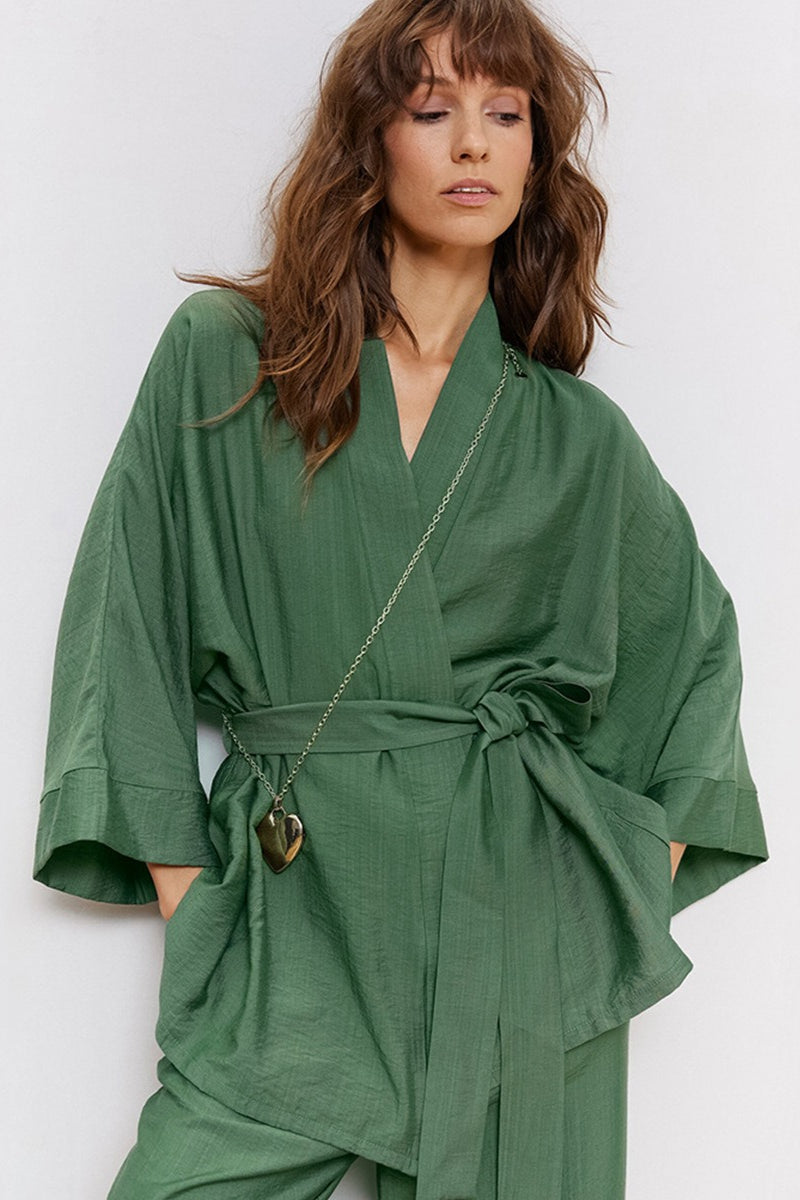 Tie-waist detail on a long-sleeve women's pajama top