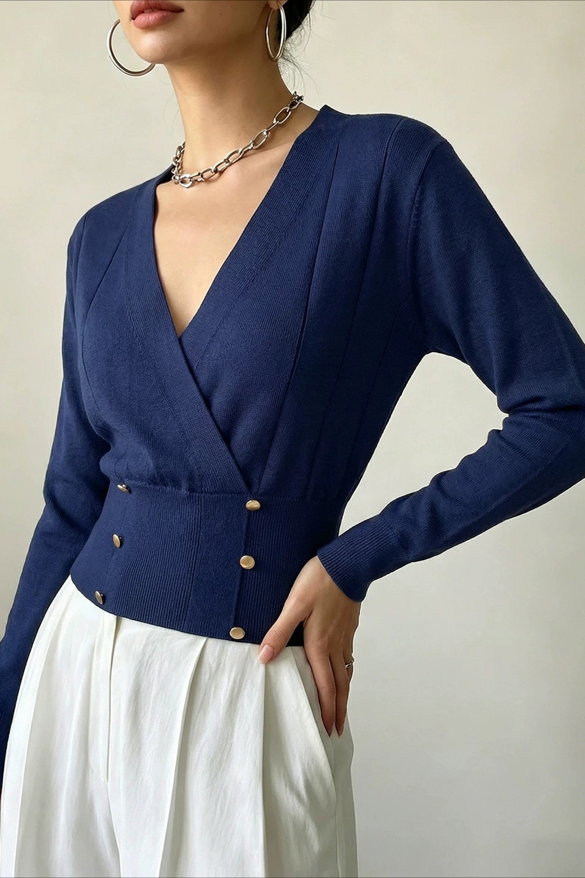 Detailed view of the wrap front and overlapping cardigan panels