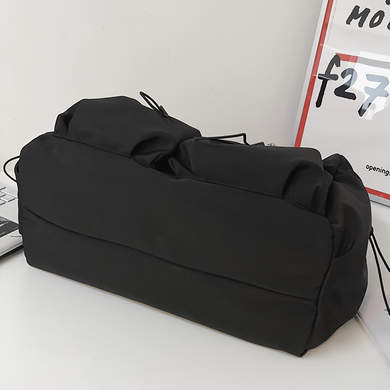 Women's drawstring crossbody bag with roomy interior and pockets