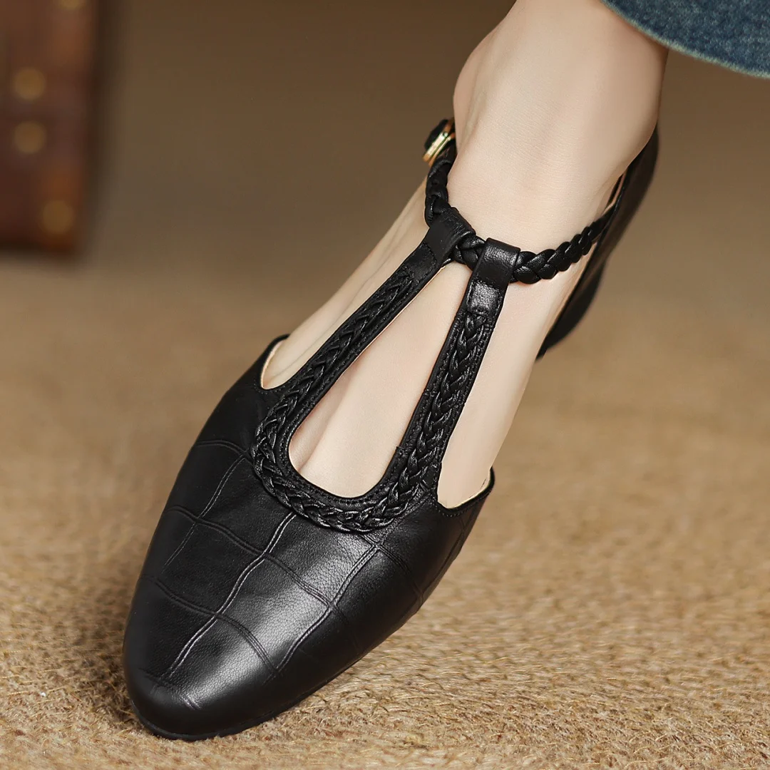 Pair of women's leather T-strap dress shoes