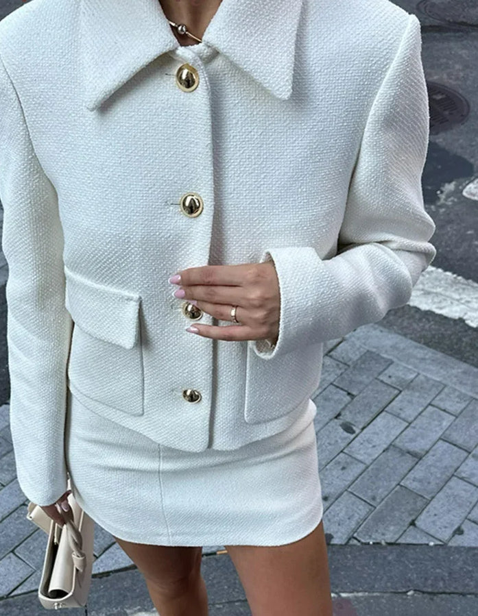 Women's two-piece set with a cropped jacket and mini skirt for office wear