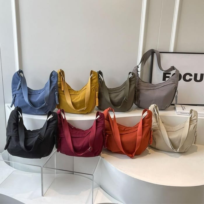 Women's nylon crossbody bag with adjustable strap and front zip pockets