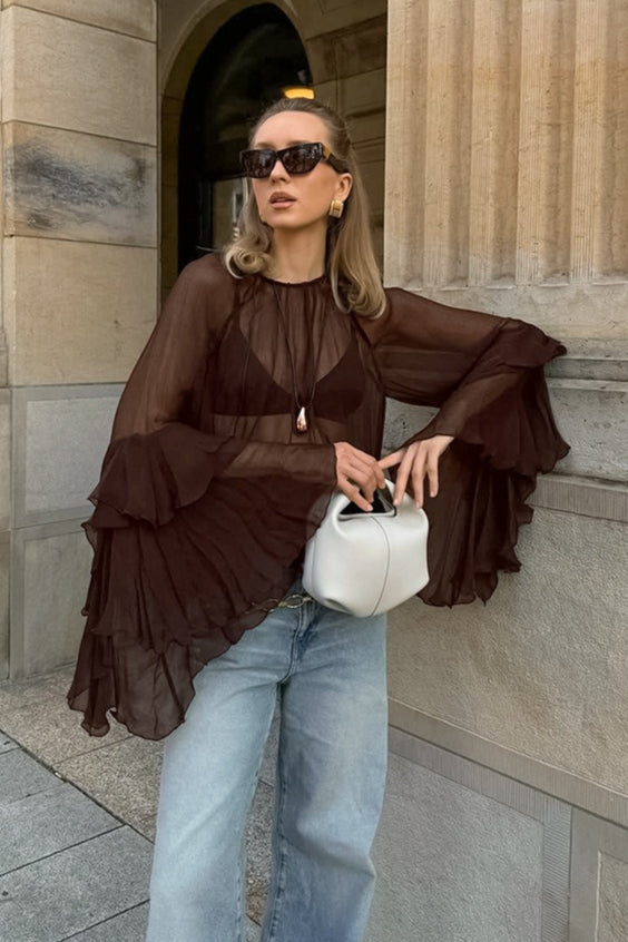 Front view of a sheer chiffon ruffle cape sleeve blouse