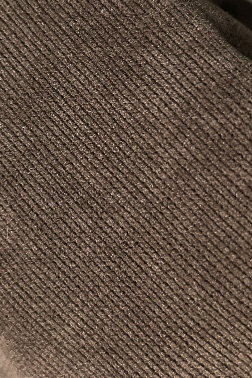 Back view of the corduroy bomber jacket showing its classic silhouette