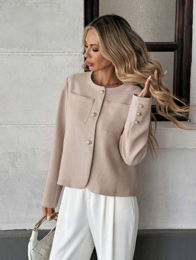 Side view of the women's short tweed jacket highlighting its cropped length