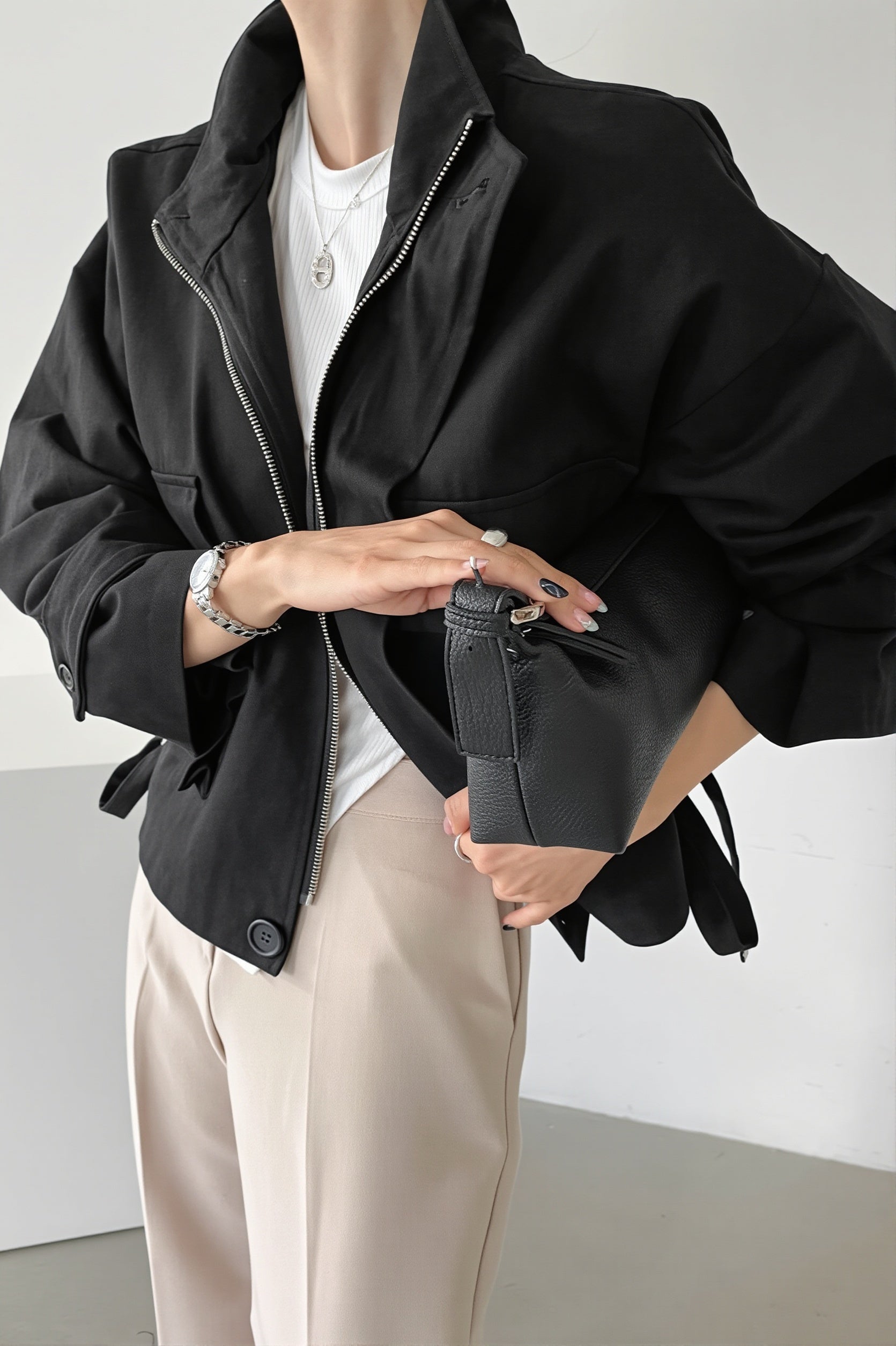 Back view of the oversized utility jacket showing its clean design