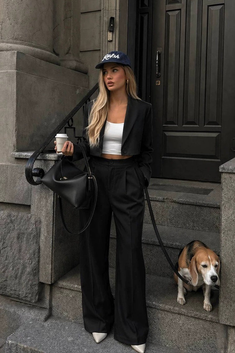 Women's two-piece blazer and pants set styled as a tailored outfit