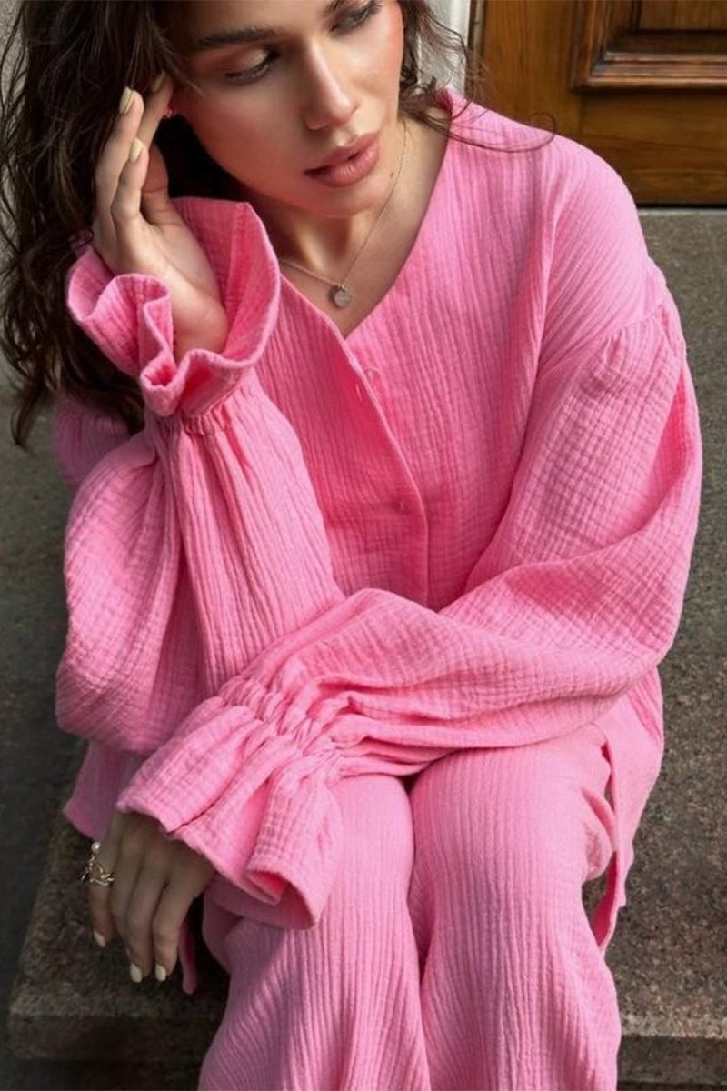 Side view showing the relaxed fit of the cardigan and wide-leg pants