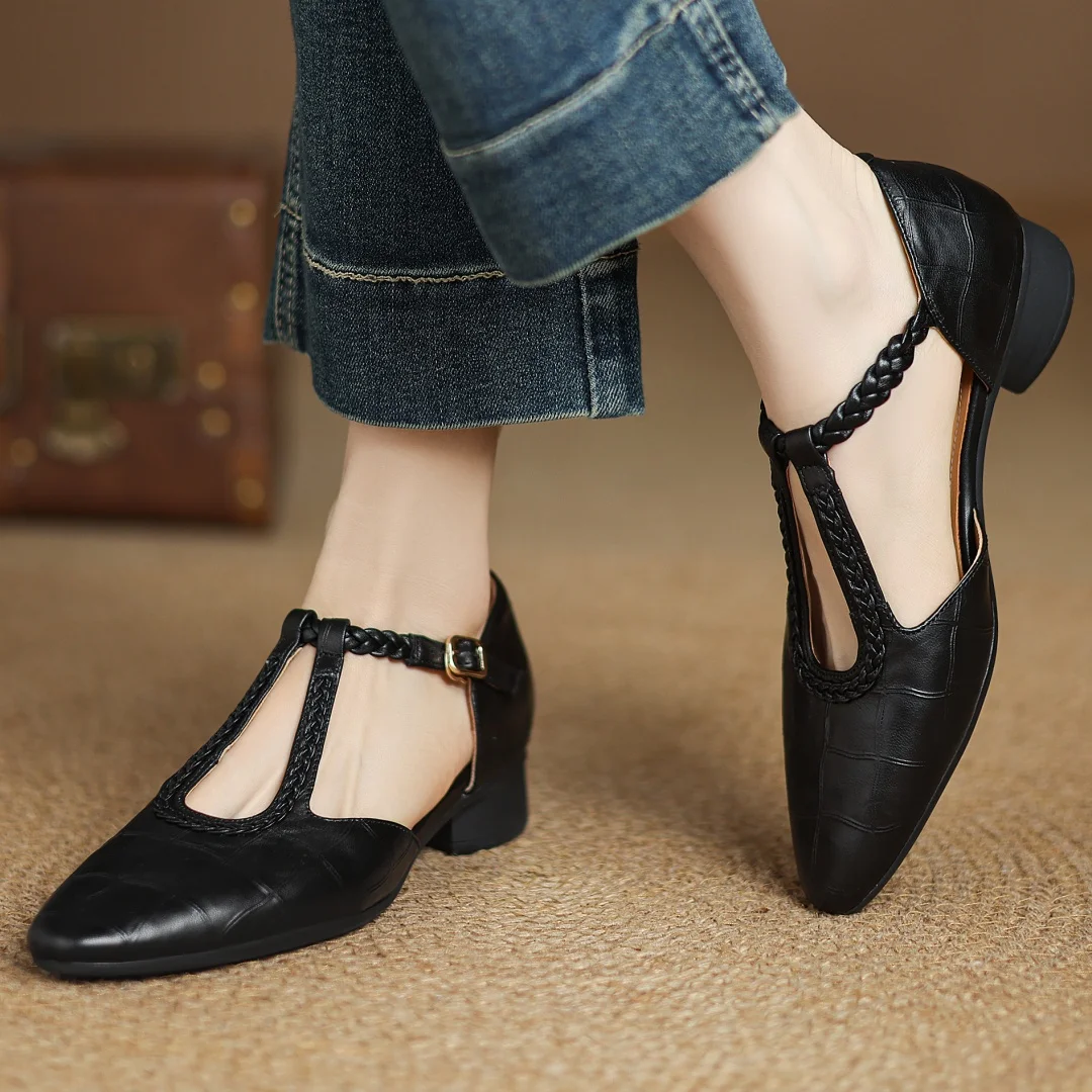Close-up of the woven detail on women's leather T-strap shoes
