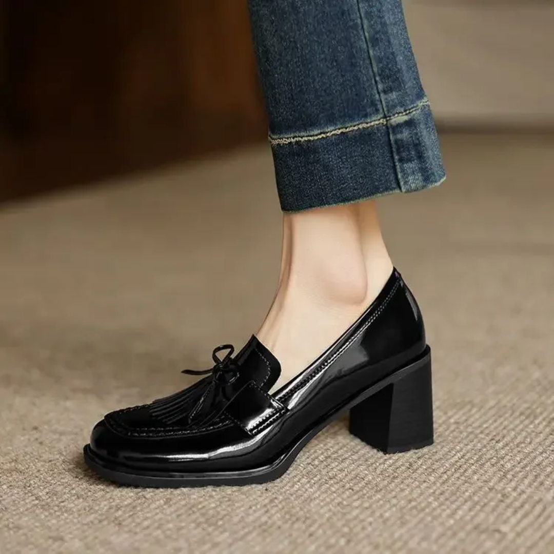 Pair of women's heeled loafers shown from the front