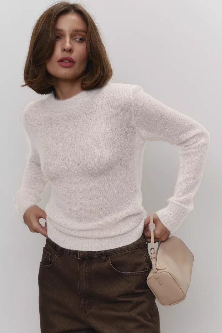 Lightweight semi-sheer crewneck sweater showing the neckline and knit texture