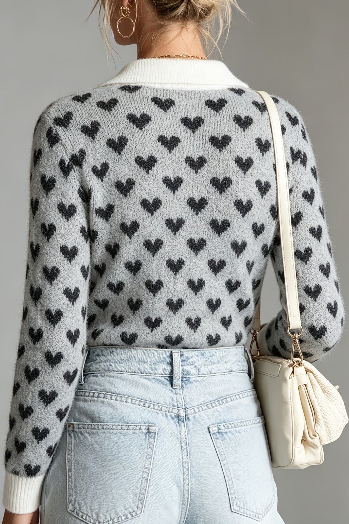 Front view of a heart pattern collared knit sweater