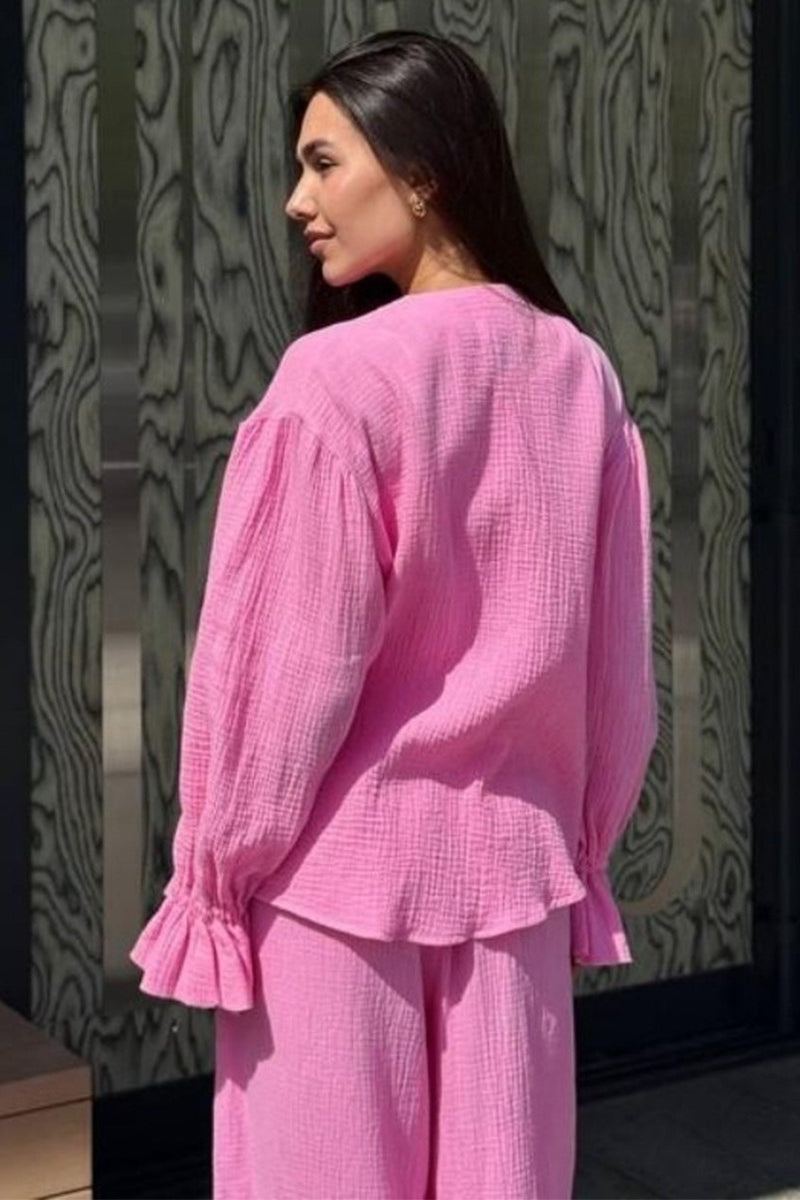 Women's wide-leg pants paired with a coordinating cotton cardigan