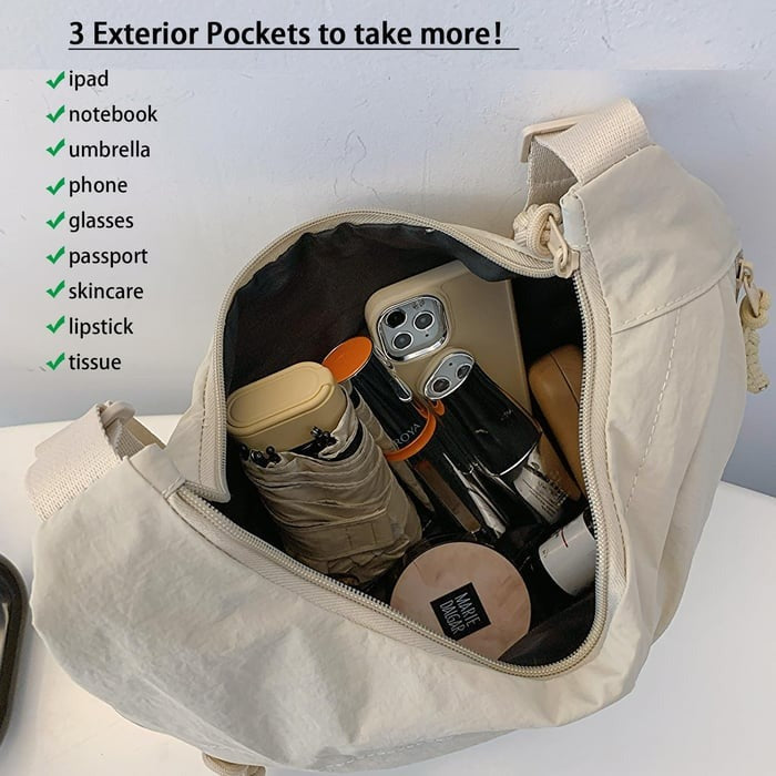 Women's travel-friendly crossbody bag with multiple zip pockets and strap