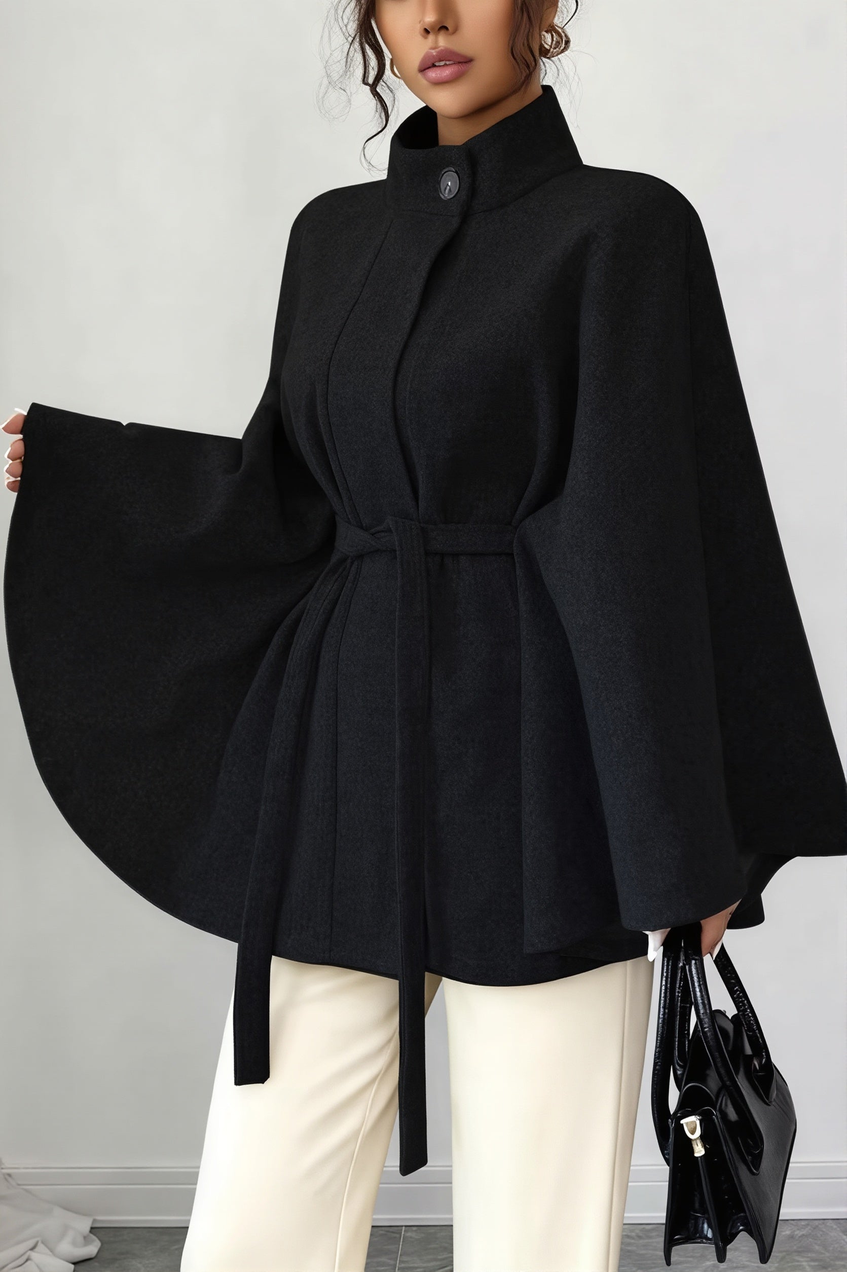 Close-up of the cape sleeves and tailored neckline on a women's jacket