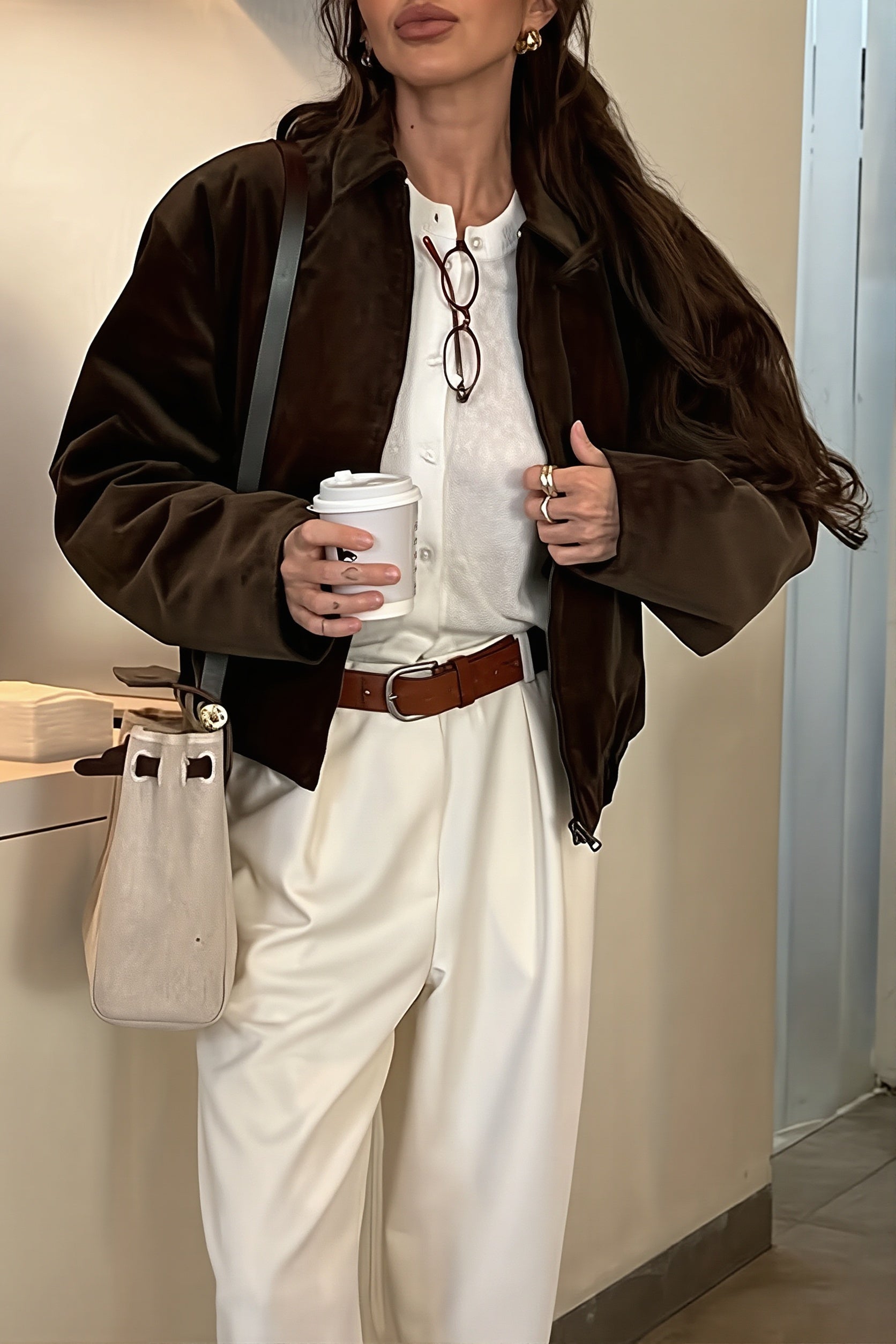 Corduroy bomber jacket displayed with its front closure and pockets