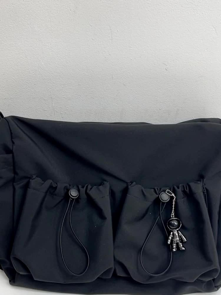 Women's crossbody bag displayed with adjustable strap and practical pockets