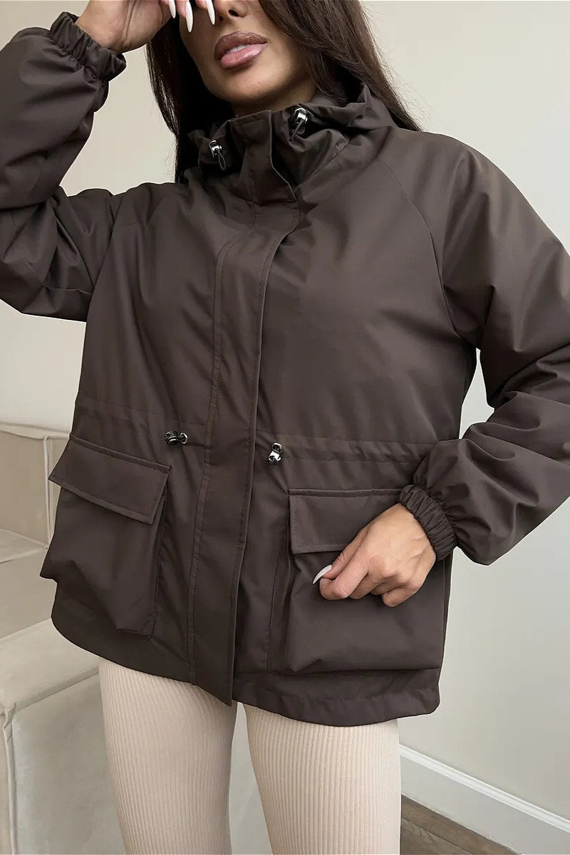 Utility jacket featuring a drawstring waist for an adjustable fit