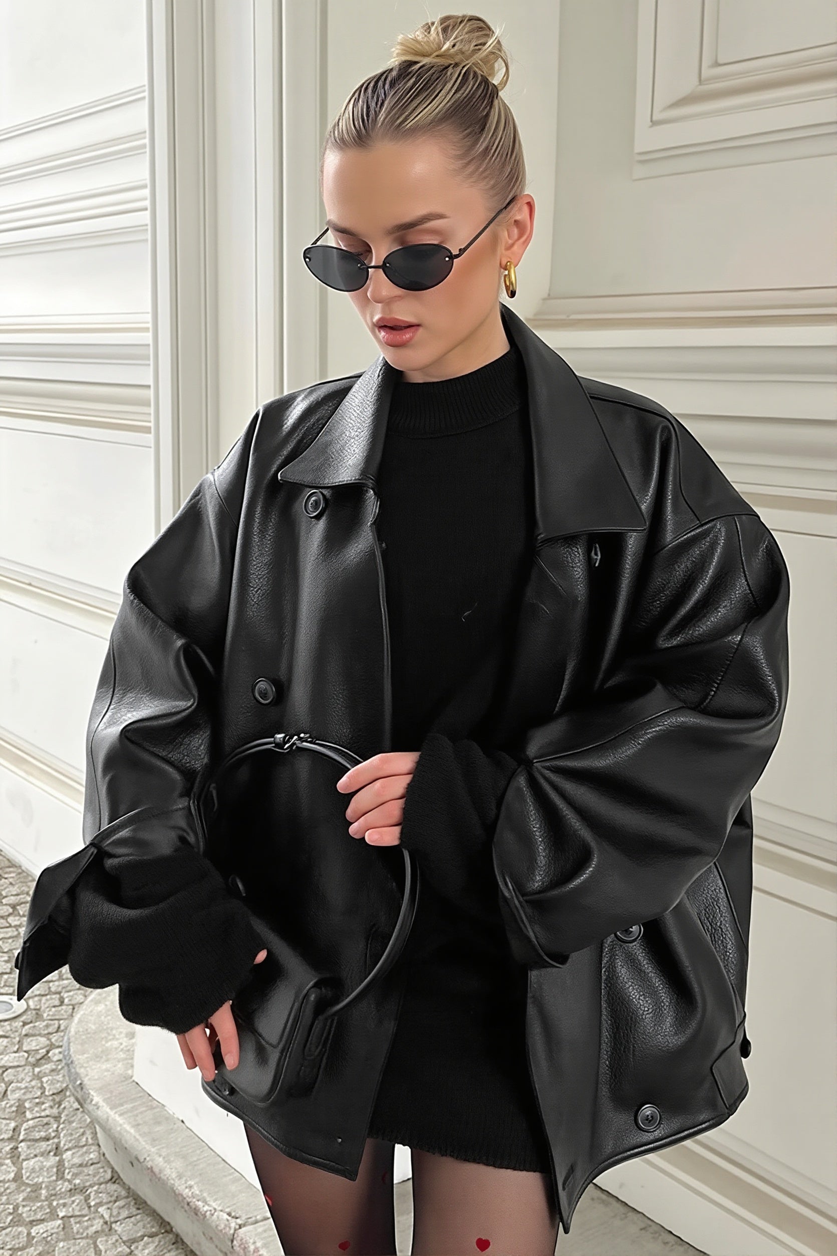 Faux leather double-breasted blazer with notched lapels shown from the front